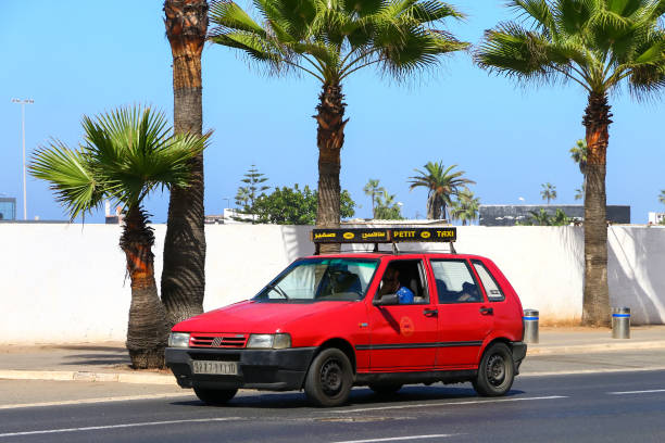 Fiat Uno Casablanca, Morocco - September 29, 2019: Red taxi car Fiat Uno in the city street. little fiat car stock pictures, royalty-free photos & images