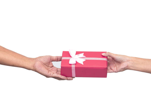 istock Woman hands receiving package gift box from a man 1187756287