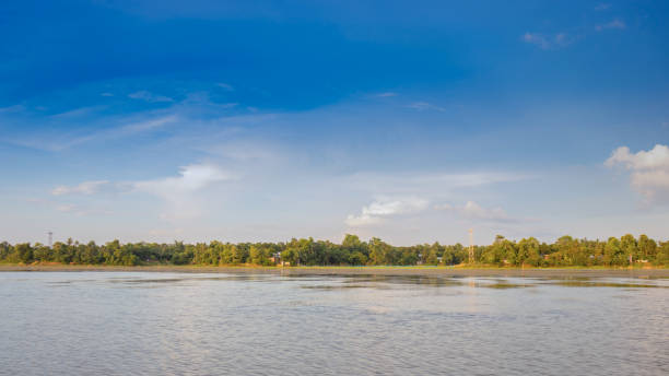 istock The blue skyline as viewed from a forest lake 1187758254