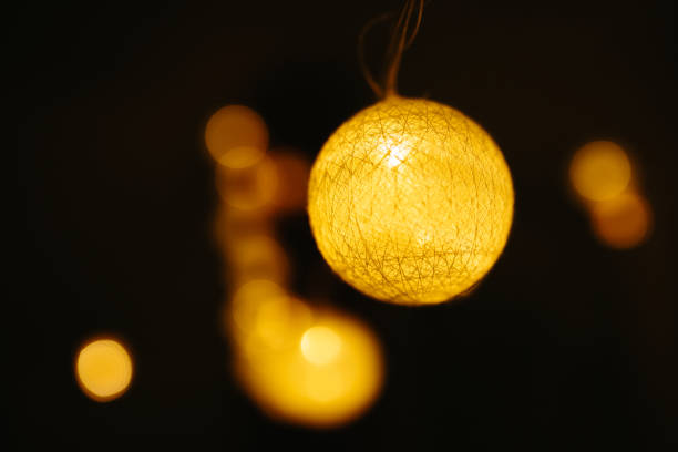 Christmas lights on dark background. Ball shaped.