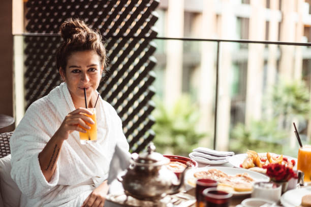 istock woman at the table for the buffet breakfast with fruit 1187760077