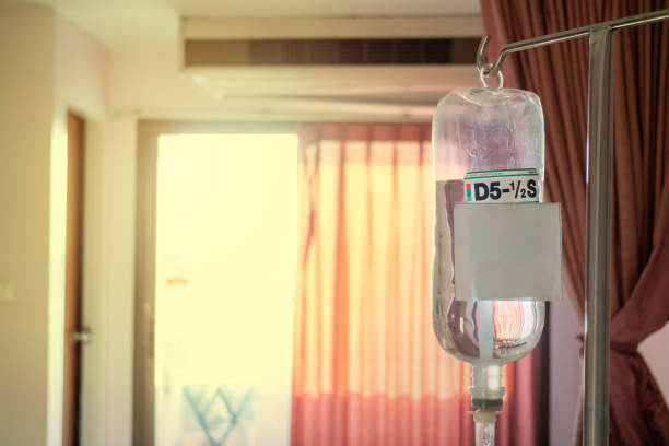 saline infusion in the hospital. saline container for patients who are hospitalized. - iv pump imagens e fotografias de stock
