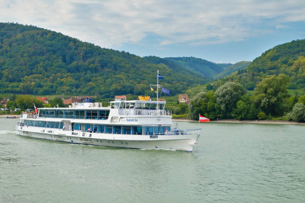 Dürnstein, Austria - August 13th 2018:The passenger ship (MS Austria of the Company Brandner) on the Danube. The ship approaches the pier of the famous town Dürnstein.