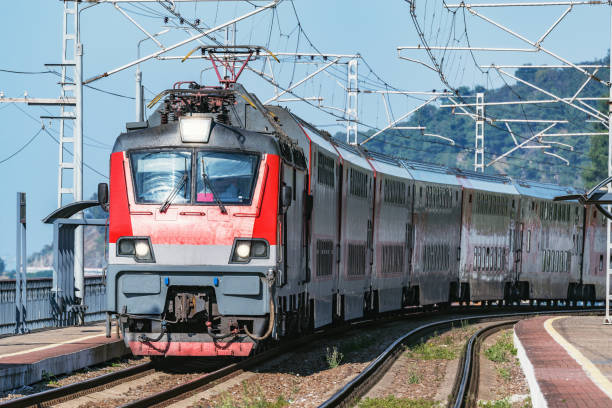 istock Passenger double deck train moves along the platform by the Black sea coast. 1187768810