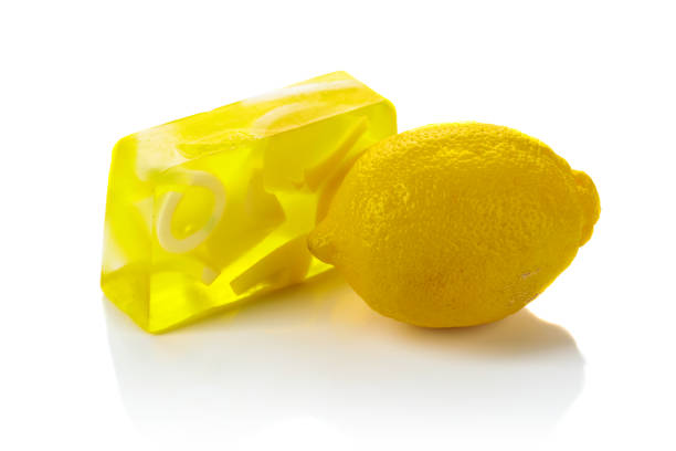 Handmade soap bar with lemon. Organic soap. Spa treatments. Isolated on a white background.