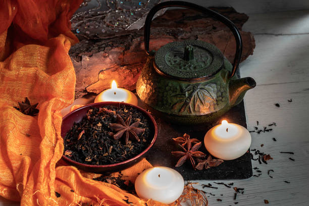 istock Green iron teapot on slate stone accompanied by Turkish tea and aromatic star anise 1187771021