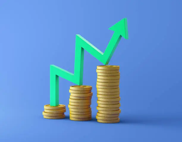 Photo of Coin stacks and chart graph on blue background