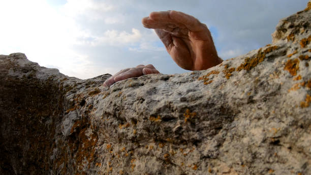 istock Mountaineer traverses rock summit 1187772538