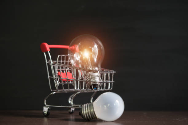 istock Shopping cart with light bulb. 1187773476