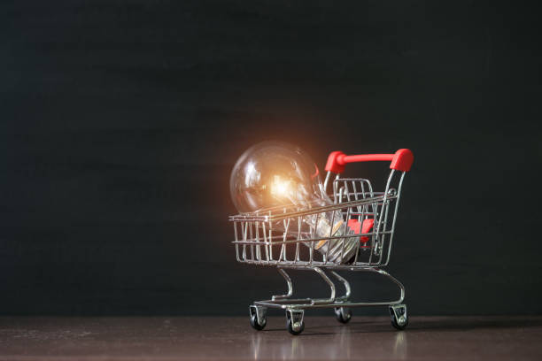 istock Shopping cart with light bulb. 1187773481