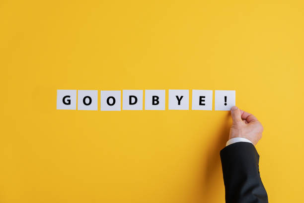 Businessman making a goodbye sign stock photo