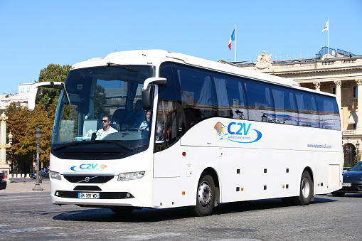 Paris, France - September 15, 2019: White touristic coach bus Volvo 9700H in the city street.