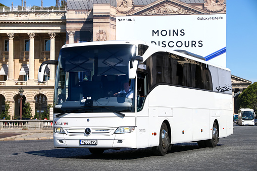 Paris, France - September 15, 2019: White touristic coach bus Mercedes-Benz O350-15RHD Tourismo in the city street.