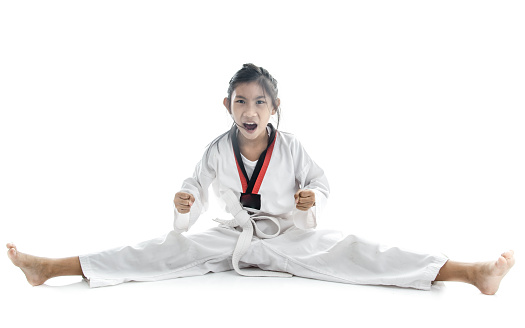 Asian taekwondo girl on with background.