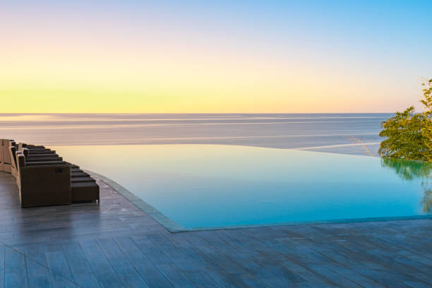 istock Infinity Edge Swimming Pool Water, Beautiful Black Sea View at sunset. 1187779476