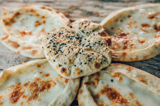 istock Traditional turkish pide or pita with beef, cheese and vegetables. 1187785008