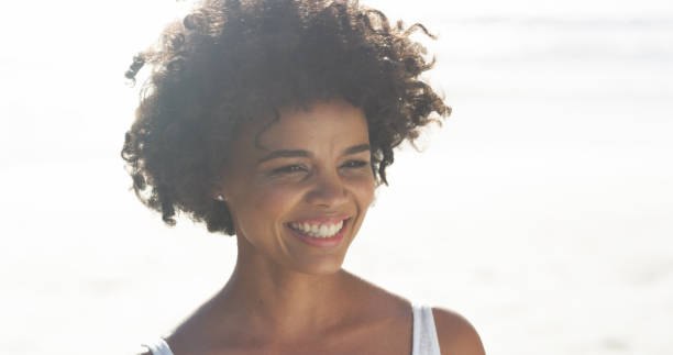 istock She can't help but smile at the beach 1187789054