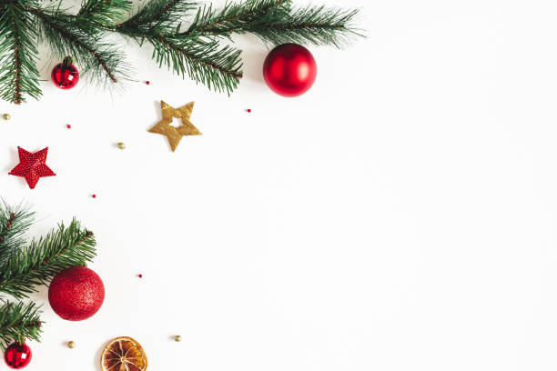 istock Christmas composition. Fir tree branches, red and golden decorations on white background. Christmas, winter, new year concept. Flat lay, top view, copy space 1187789566