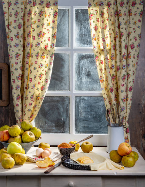 istock some ingredients for apple pie, apples, eggs, dough, near the window 1187792754