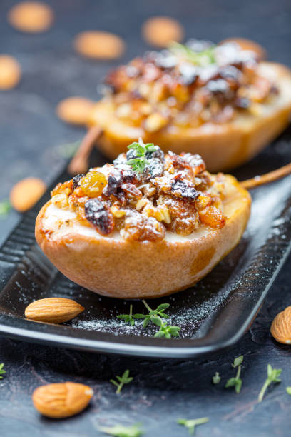 istock Pears baked in honey with raisins and nuts. 1187792773