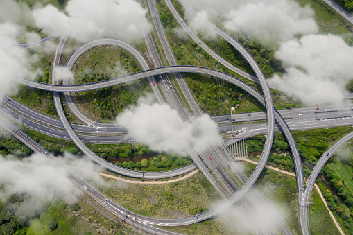 Aerial photograph of a highway crossing with clouds
