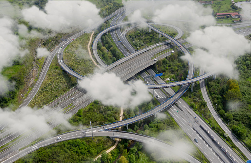 Aerial photograph of a highway crossing with clouds