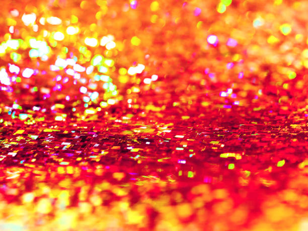 istock Bright orange background. Shiny and sparkling holographic rainbow backdrop. 1187795835