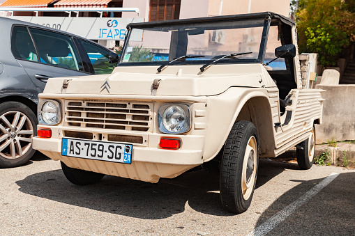 Ajaccio, France - August 25, 2018: Beige Citroen Mehari car stands parked on a street in France, close-up photo