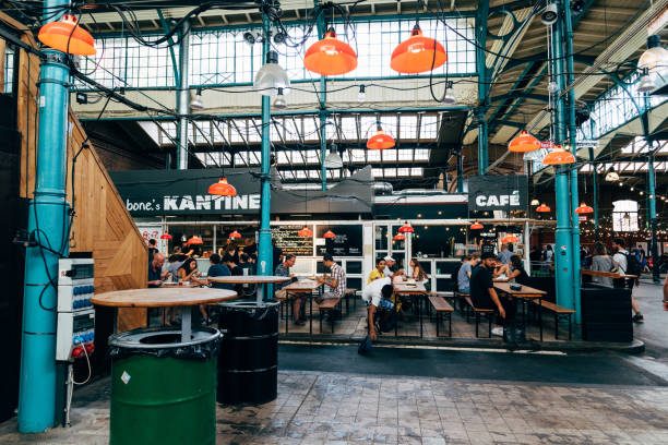 view of markthalle neun, a historical market with street food in kreuzberg borough in berlin - kreuzberg imagens e fotografias de stock