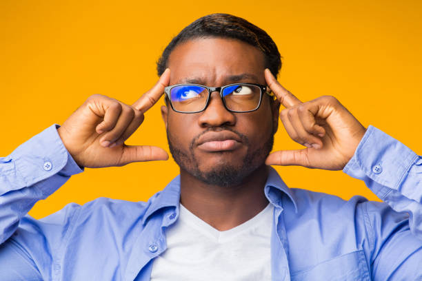 istock Thoughtful Black Man Concentrating Hard Standing On Yellow Background 1187796163