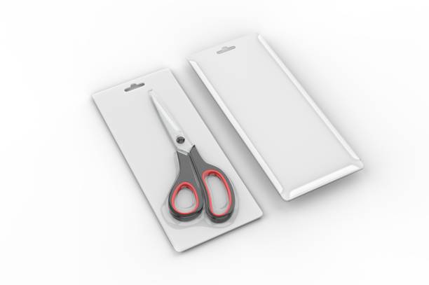 Three scissors of different sizes in a glass jar.