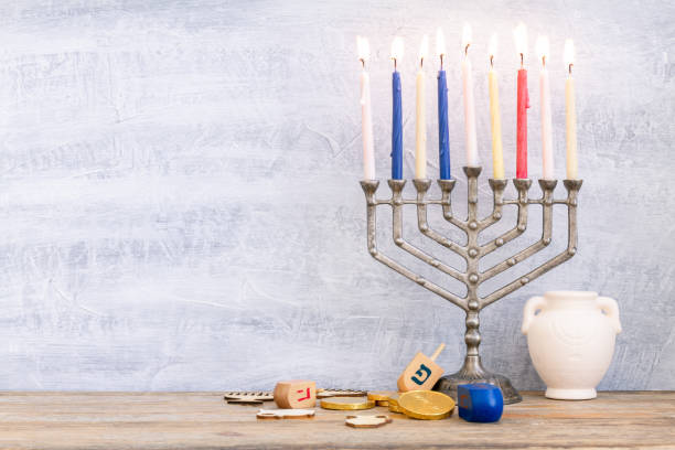 istock Menorah, dreidels and hanukkah coins. 1187797039