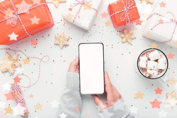 istock Woman holding cellphone with empty blank screen 1187798347