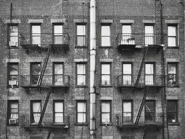 Photo of Old brick house with fire escapes, New York, USA.