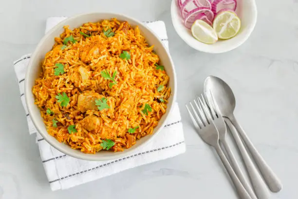 Indian Chicken Pulao, Chicken Fried Rice with Lemon and Onion, Top View Food Photography.