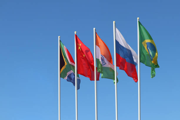 istock BRICS flags waving against the clear blue sky 1187799698