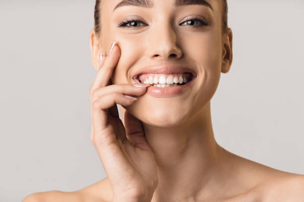 Stomatology concept. Girl with strong white teeth