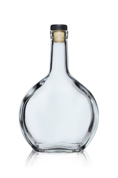 istock Empty glass bottle of rounded shape closed with a cork, isolated on a white background with reflection 1187799872