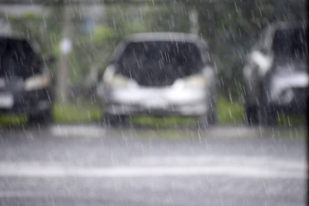 istock Rain with the car parked in the background 1187799973