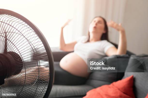 Pregnant Woman Feeling Bad For Summer Heat Stock Photo - Download Image Now - Adult, Adults Only, Air Conditioner