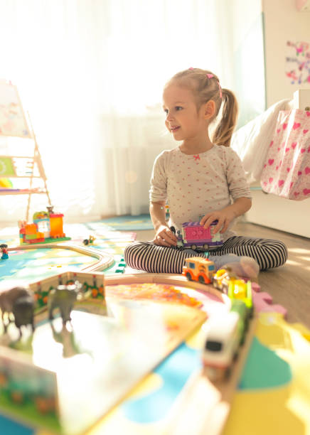 istock Girl play with a wooden set 1187800997