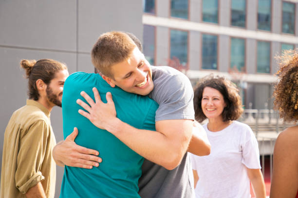 istock Multiethnic friends greeting each other 1187801783