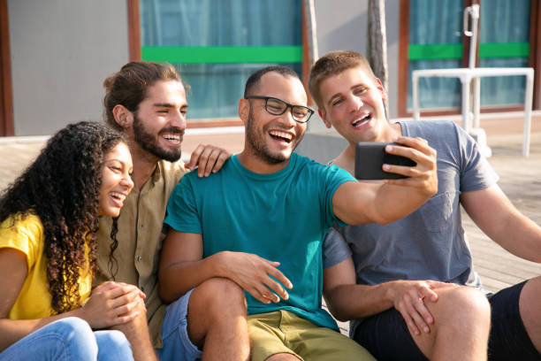 istock Cheerful young friends during video chat 1187802295