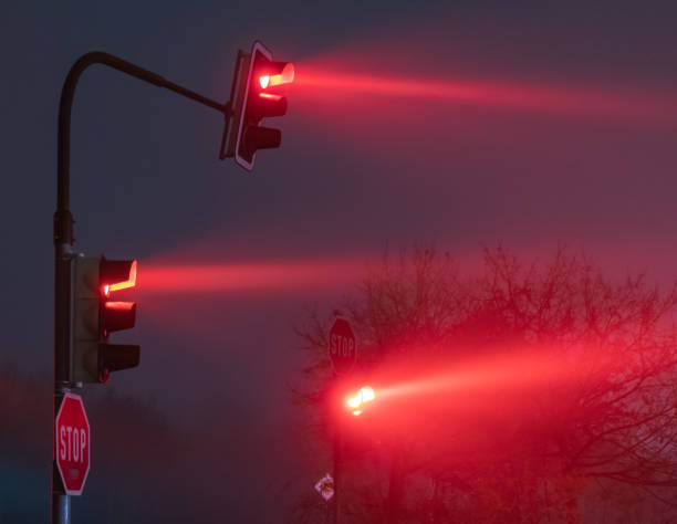 istock red traffic lights in a foggy night 1187802921