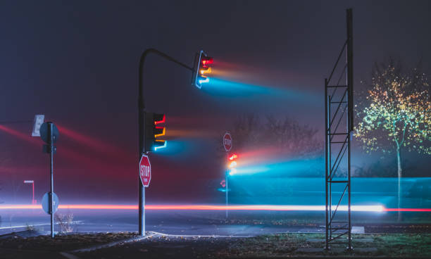 istock traffic lights in a foggy night 1187802948