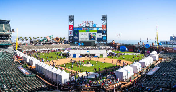 Panoramic view of Oracle Park during the Bay Area Science Festival event, San Francisco Nov 2, 2019 San Francisco / CA / USA - Panoramic view of Oracle Park during the Bay Area Science Festival event; People visiting the business representative booths set up on the field; free access, no ticket required stadium advertising stock pictures, royalty-free photos & images