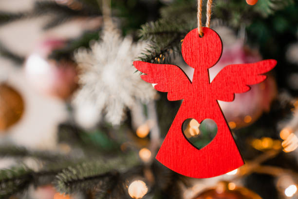 Close up shot of Christmas tree decoration angel toy stock photo