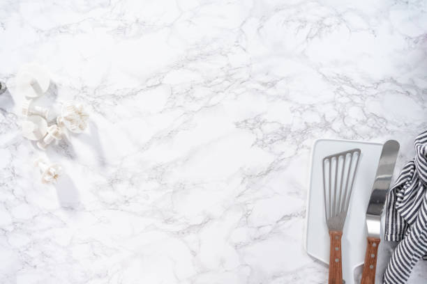 istock Rolling out fondant to cut snowflake shapes 1187806598