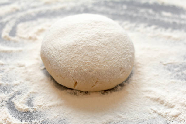 istock Fresh shortbread pastry sprinkled with flour on a dark background 1187806730