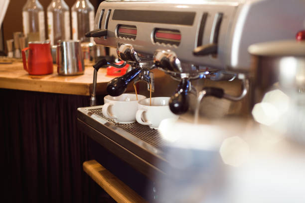 istock Barista make coffee latte art with espresso machine in cafe. 1187807315